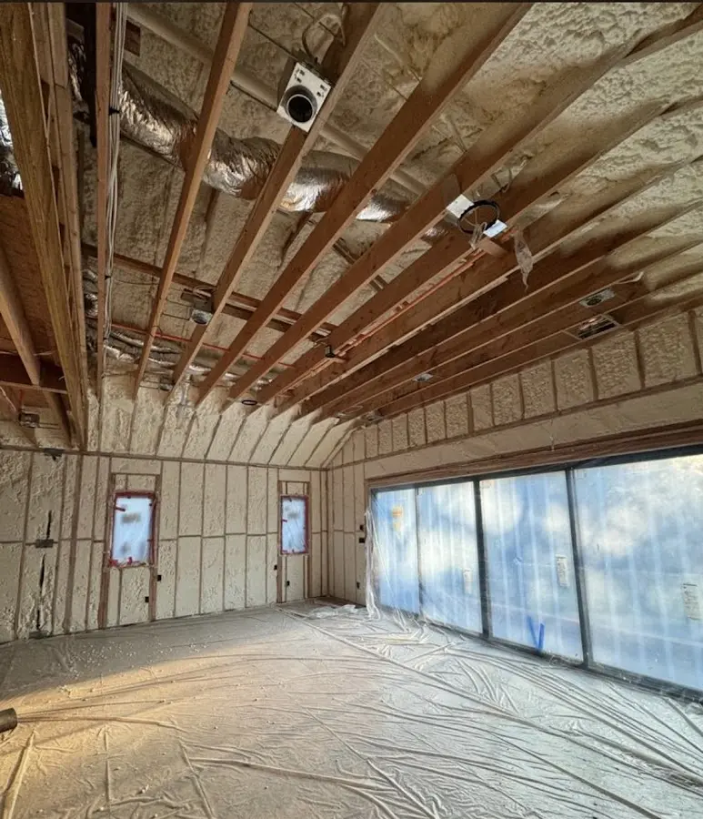 Interior walls and ceiling insulated with spray foam during new construction in South Bound Brook